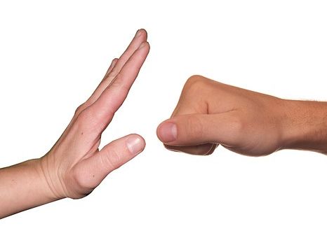 An image of a fist moving towards a hand