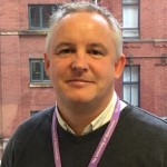 Profile of a man smiling