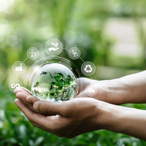 Infographic of an Earth globe resting in the palm of a hand surrounded by symbols representing various environmental impacts